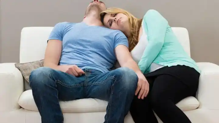 Tired husband and wife dealing with daily stress at home